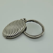 Load image into Gallery viewer, Antique Sterling Silver Sliding Locket.